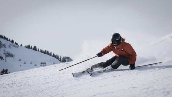 man skiing turning